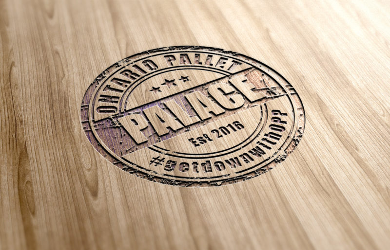 Ontario pallet palace logo design by scr enter dibyendu roy rubber emblem on wooden surface mock up presentation